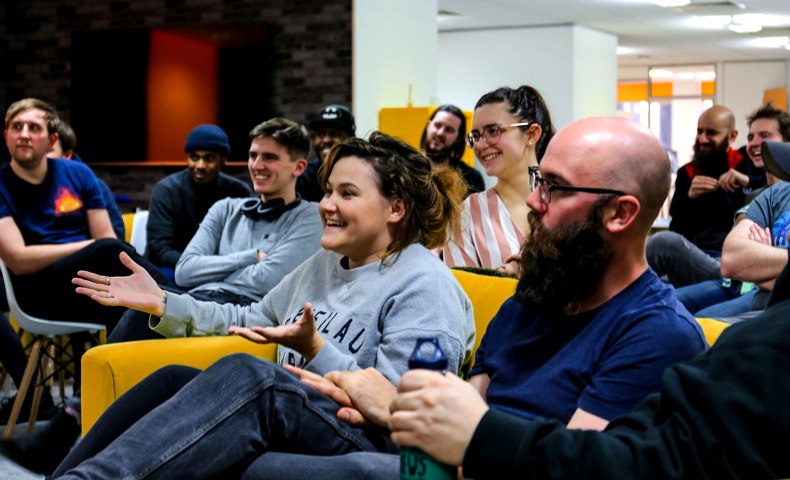 Student Laughing During A Coding Discussion_Body Image | Code Nation